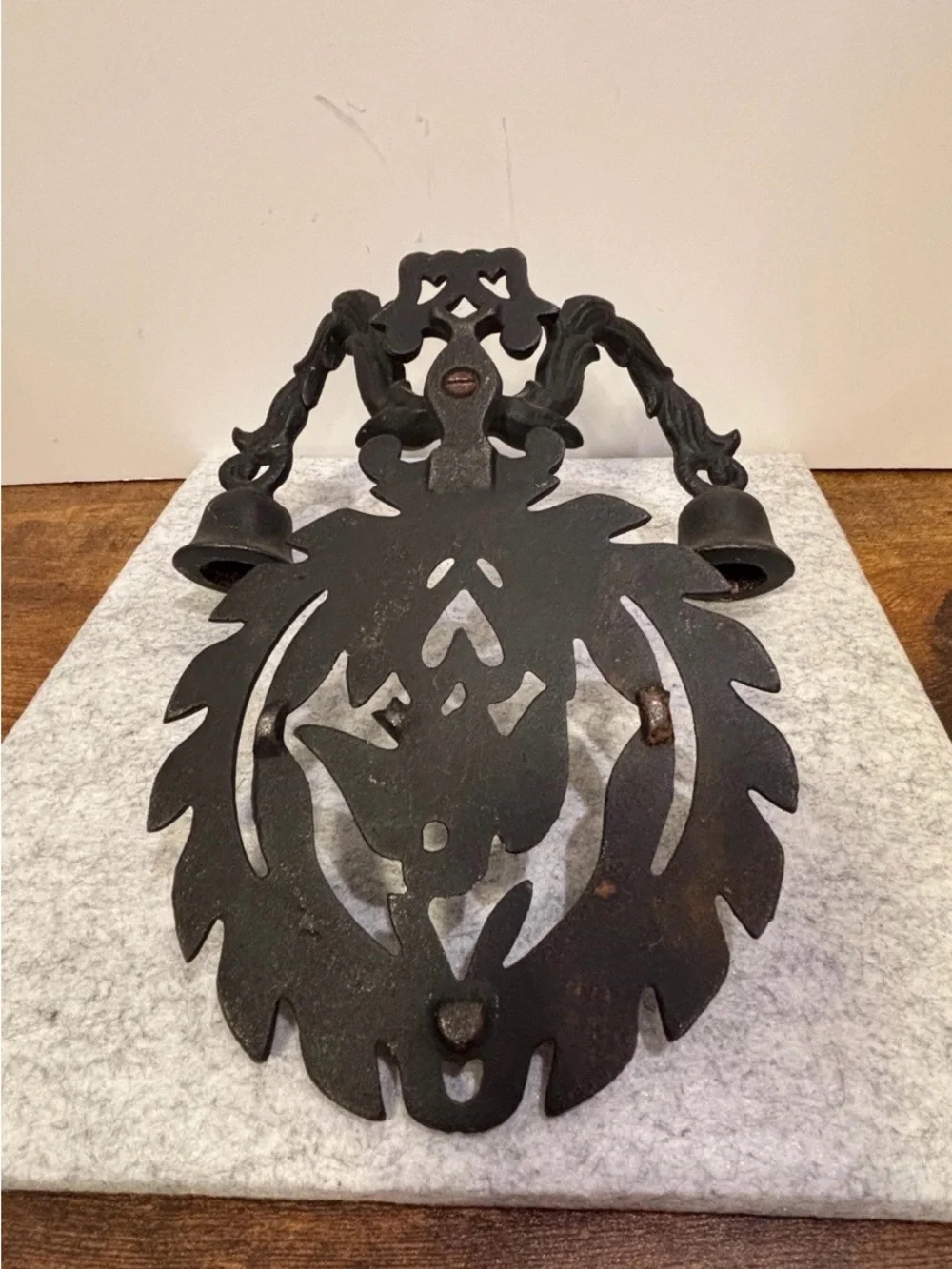 A pair of vintage cast iron wall sconces with eagle and laurel wreath motif